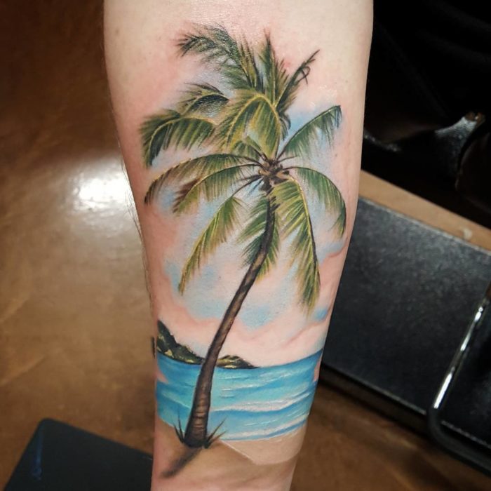 beach tattoo on arm