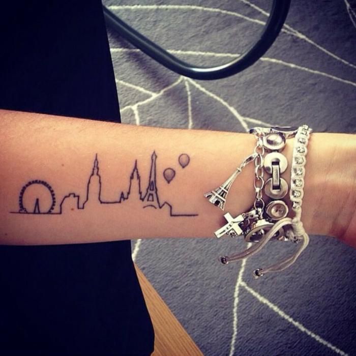 city tattoo on arm