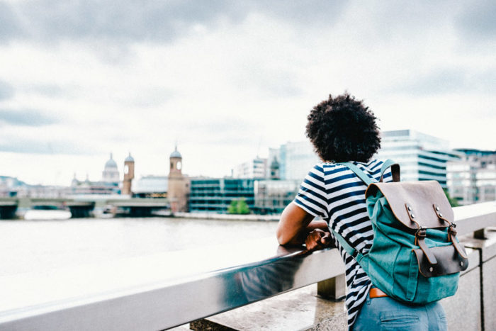 solo traveler in london observing the skyline