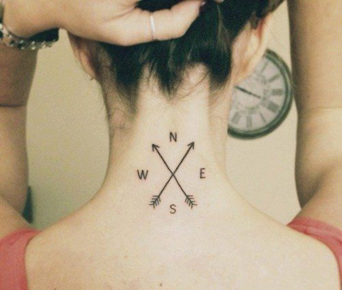 simple arrow compass tattoo on a woman\'s neck