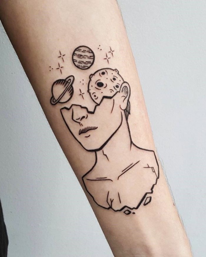 space objects tattoo on arm