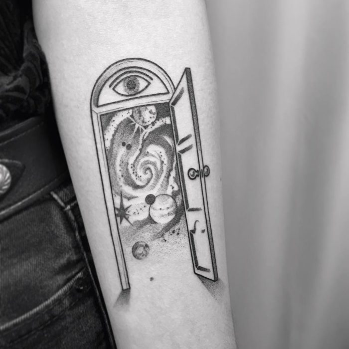 space travel tattoo on arm