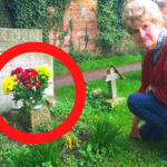 woman at the grave and flowers