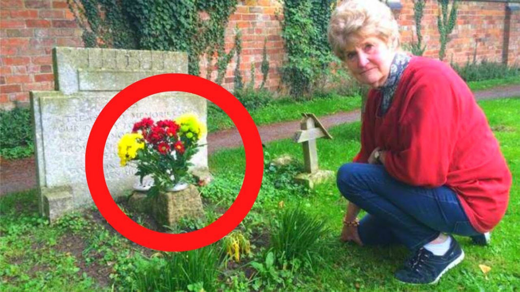 woman at the grave and flowers
